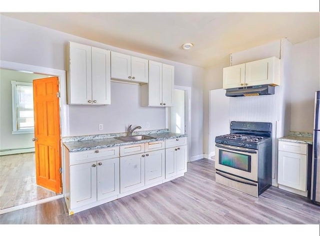 184 Wadsworth St, Providence, RI 02909 - kitchen with appliances with stainless steel finishes, under cabinet range hood, a sink, and white cabinets
