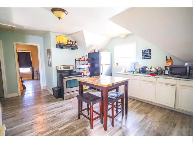 184 Wadsworth St, Providence, RI 02909 - kitchen with appliances with stainless steel finishes, light wood-style flooring, lofted ceiling, under cabinet range hood, and white cabinets