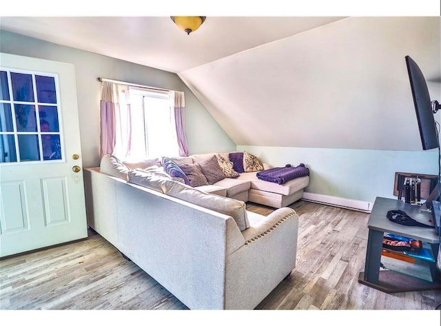 184 Wadsworth St, Providence, RI 02909 - living area with vaulted ceiling, wood finished floors, baseboard heating, and baseboards