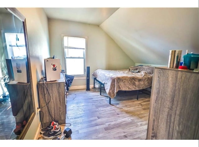 184 Wadsworth St, Providence, RI 02909 - bedroom with lofted ceiling, wood finished floors, and baseboards