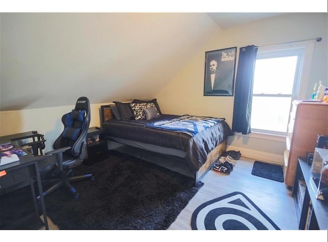 184 Wadsworth St, Providence, RI 02909 - bedroom with vaulted ceiling, wood finished floors, and baseboards