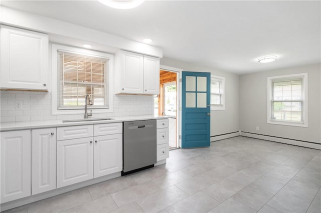 kitchen with dishwasher, a sink, healthy amount of natural light, light countertops, and recessed lighting