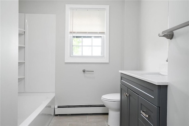 full bathroom with baseboard heating, vanity, and toilet