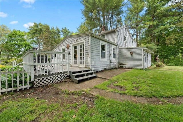 18 W St, Hopkinton, RI 02804 - rear view of property with a chimney, a wooden deck, a yard, and french doors