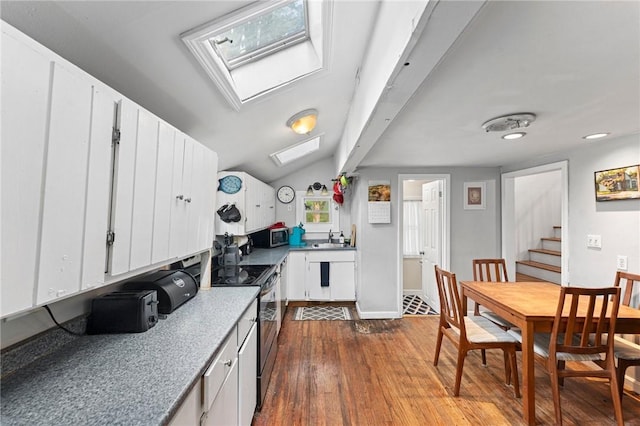 18 W St, Hopkinton, RI 02804 - kitchen with a skylight, range with electric stovetop, dark wood-style floors, a sink, and white cabinets
