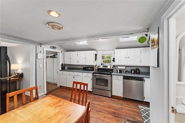 18 W St, Hopkinton, RI 02804 - kitchen featuring appliances with stainless steel finishes, dark countertops, white cabinets, and dark wood finished floors