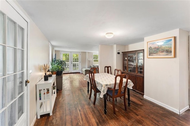 18 W St, Hopkinton, RI 02804 - dining area featuring french doors, dark wood-style floors, and baseboards