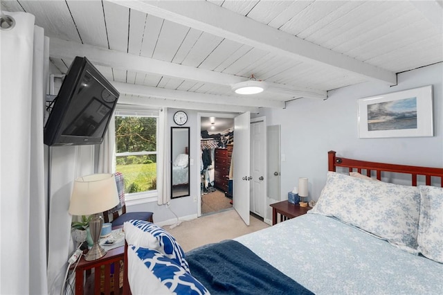 18 W St, Hopkinton, RI 02804 - carpeted bedroom with a walk in closet, beamed ceiling, a closet, baseboards, and wood ceiling