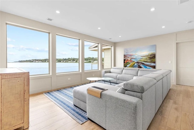 82 Ellery Rd, Newport, RI 02840 - living room featuring light wood finished floors, recessed lighting, and a water view