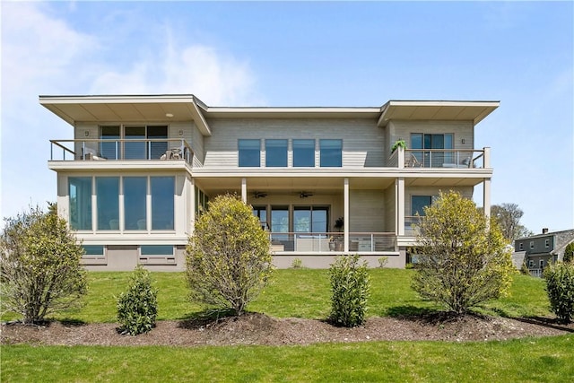 82 Ellery Rd, Newport, RI 02840 - back of property featuring a balcony, a ceiling fan, and a yard