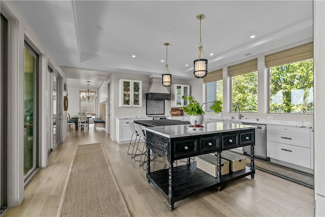 82 Ellery Rd, Newport, RI 02840 - kitchen with white cabinets, a chandelier, light countertops, dishwasher, and recessed lighting