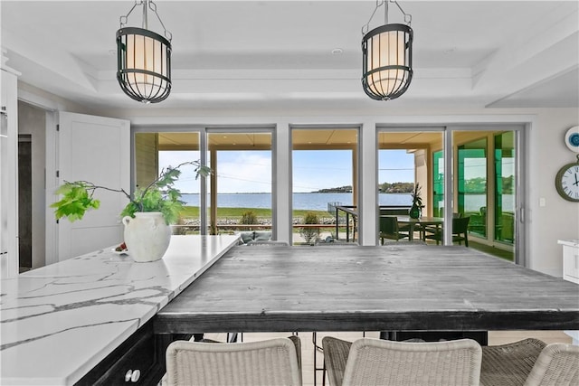 82 Ellery Rd, Newport, RI 02840 - dining room with a water view, healthy amount of natural light, and a chandelier