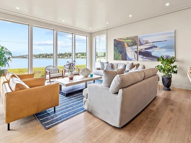 82 Ellery Rd, Newport, RI 02840 - living room featuring light wood-type flooring, a water view, recessed lighting, and baseboards