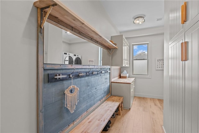 82 Ellery Rd, Newport, RI 02840 - mudroom with separate washer and dryer, light wood-type flooring, and baseboards