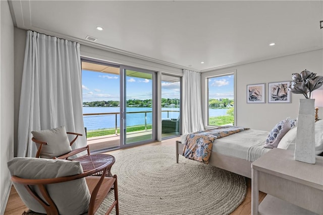 82 Ellery Rd, Newport, RI 02840 - bedroom featuring access to outside, a water view, wood finished floors, and recessed lighting