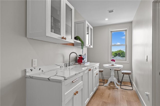82 Ellery Rd, Newport, RI 02840 - bar featuring baseboards, a sink, light wood-type flooring, and recessed lighting