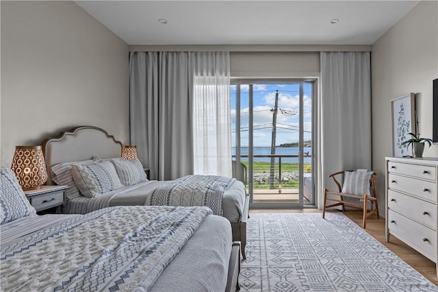 82 Ellery Rd, Newport, RI 02840 - bedroom with a water view, access to outside, and wood finished floors