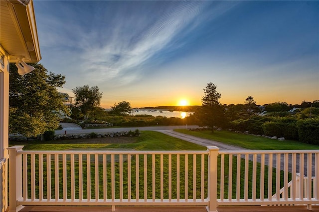 112 Avondale Rd, Westerly, RI 02891 - deck at dusk with a yard and a water view