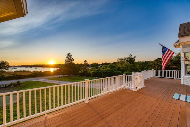 112 Avondale Rd, Westerly, RI 02891 - deck at dusk featuring a yard and a water view
