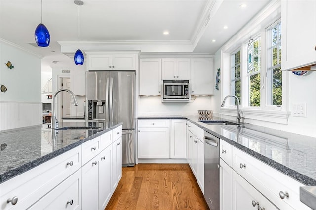 112 Avondale Rd, Westerly, RI 02891 - kitchen featuring stainless steel appliances, a sink, crown molding, light wood finished floors, and white cabinets