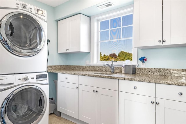 112 Avondale Rd, Westerly, RI 02891 - laundry area with cabinet space and estacked washer and dryer