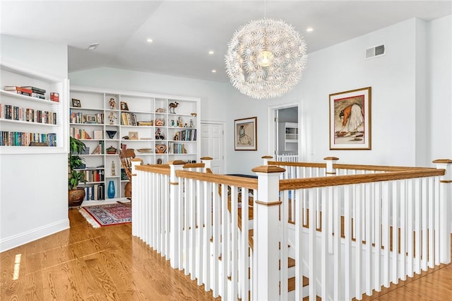 112 Avondale Rd, Westerly, RI 02891 - hallway featuring an upstairs landing, wood finished floors, a chandelier, recessed lighting, and lofted ceiling