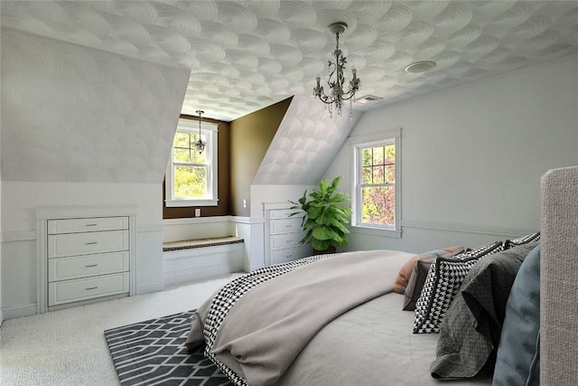 26 Old Richmond Townhouse Rd, Richmond, RI 02812 - carpeted bedroom with multiple windows, lofted ceiling, and a chandelier