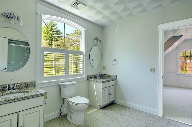 26 Old Richmond Townhouse Rd, Richmond, RI 02812 - bathroom with tile patterned floors, baseboards, two vanities, and toilet
