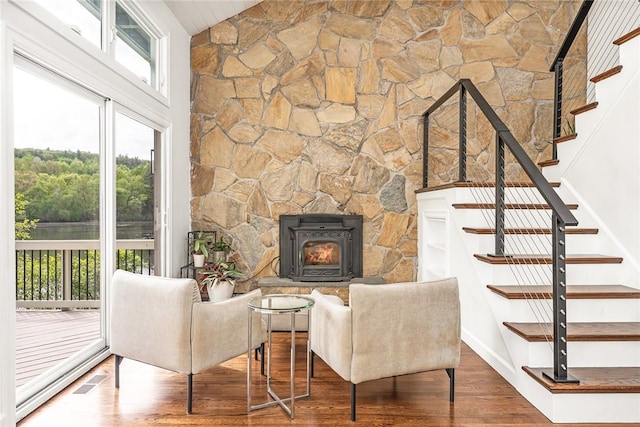 12 Hazel Point Rd, Smithfield, RI 02917 - living room with wood finished floors, stairway, a stone fireplace, and baseboards