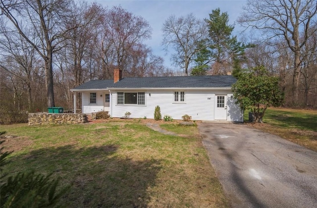247 Quaker Ln, Scituate, RI 02857 - ranch-style house with a chimney, asphalt driveway, and a front lawn