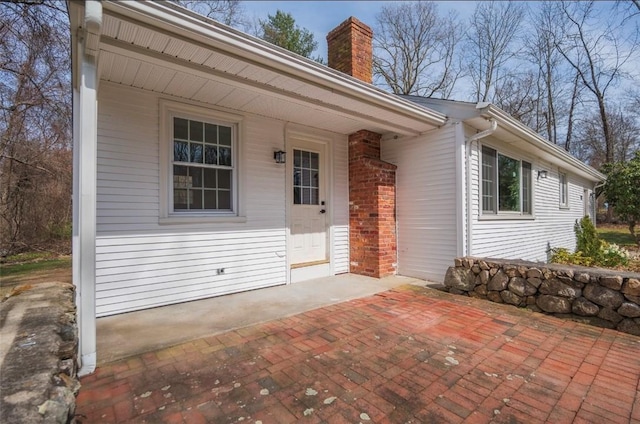 247 Quaker Ln, Scituate, RI 02857 - doorway to property with a chimney
