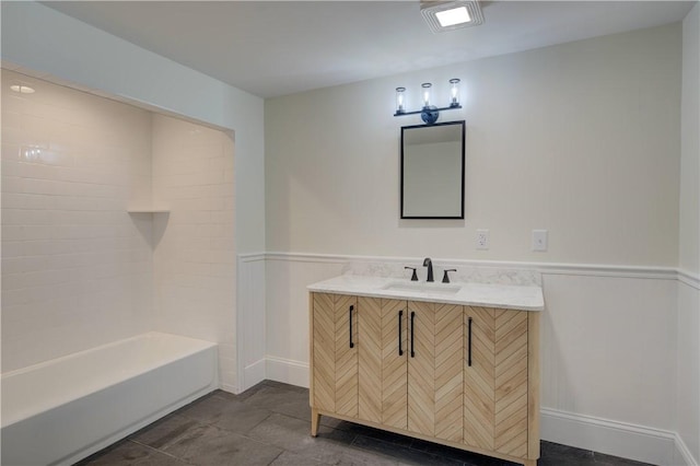 247 Quaker Ln, Scituate, RI 02857 - bathroom with a wainscoted wall, vanity, and shower / tub combination