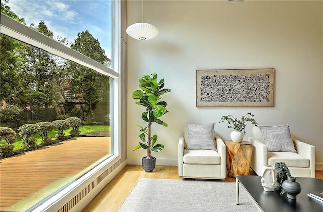 sitting room featuring wood finished floors and baseboards