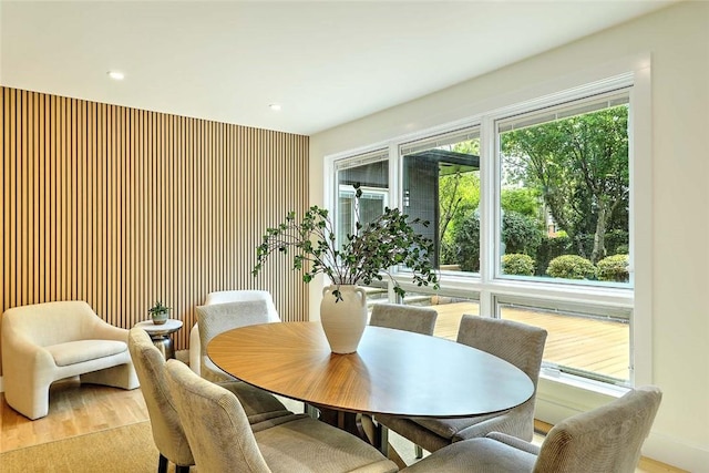 dining area featuring wood finished floors and recessed lighting