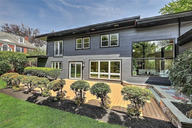 rear view of property with a deck