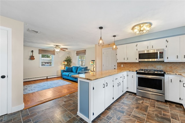 211 Iroquois Rd, Cumberland, RI 02864 - kitchen featuring stainless steel appliances, a peninsula, baseboard heating, ceiling fan, and white cabinetry