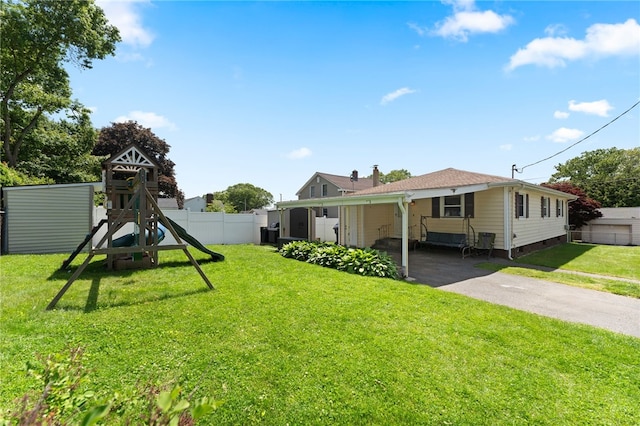211 Iroquois Rd, Cumberland, RI 02864 - view of yard with a playground and driveway