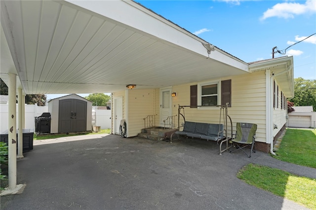 211 Iroquois Rd, Cumberland, RI 02864 - view of patio with an attached carport