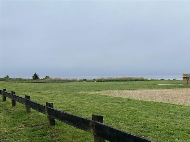view of grassy yard featuring a view of rural / pastoral area