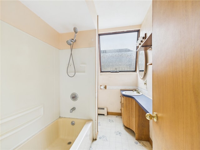 bathroom featuring a baseboard radiator, shower / washtub combination, and vanity