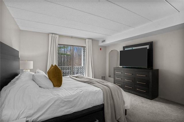 143 Hoffman Ave Unit 210, Cranston, RI 02920 - bedroom with light carpet, a textured ceiling, and access to outside