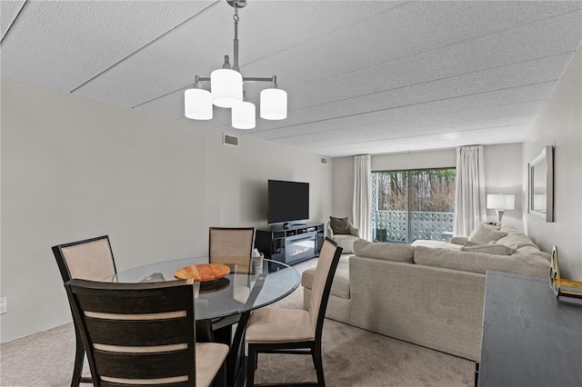 143 Hoffman Ave Unit 210, Cranston, RI 02920 - dining room with carpet and a chandelier