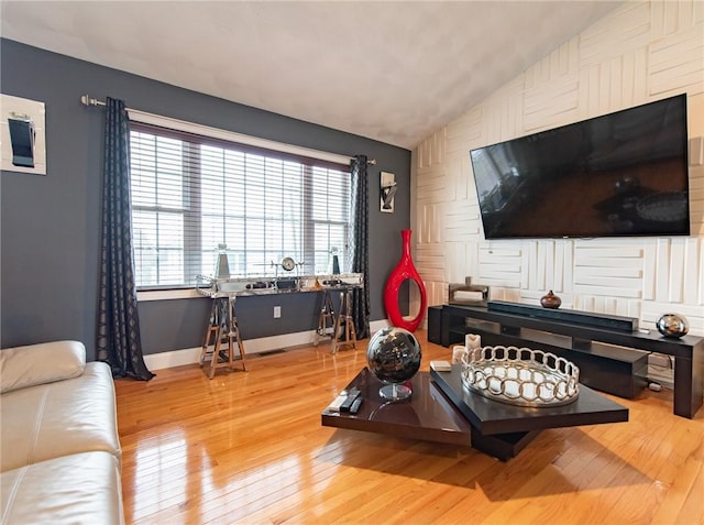 10 Flanders St, Johnston, RI 02919 - living room featuring wood-type flooring, vaulted ceiling, and baseboards