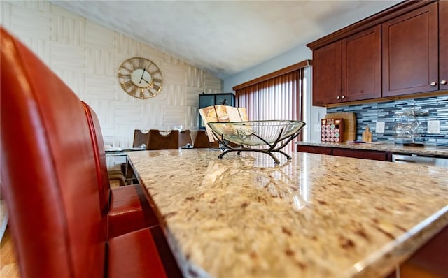 10 Flanders St, Johnston, RI 02919 - kitchen with vaulted ceiling, tasteful backsplash, and light stone counters