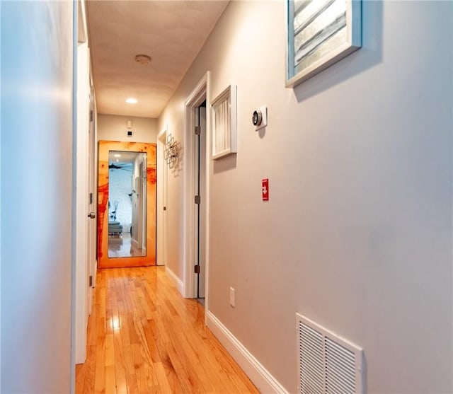 10 Flanders St, Johnston, RI 02919 - hallway with light wood-type flooring and baseboards
