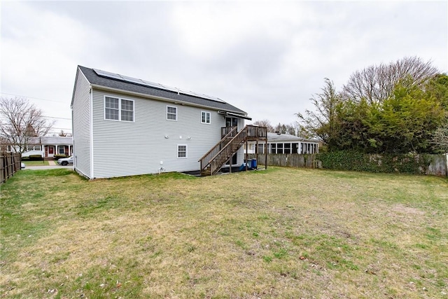 10 Flanders St, Johnston, RI 02919 - rear view of property featuring stairs, a deck, and roof mounted solar panels