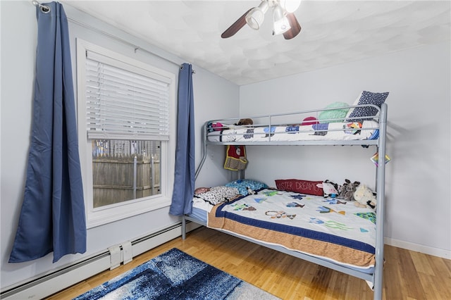 2 Sando St, Pawtucket, RI 02860 - bedroom featuring baseboard heating, wood finished floors, ceiling fan, and baseboards