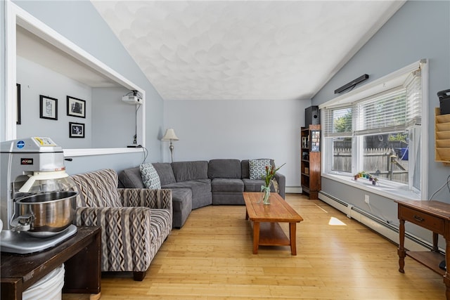 2 Sando St, Pawtucket, RI 02860 - living room with vaulted ceiling, light wood-type flooring, and a baseboard heating unit