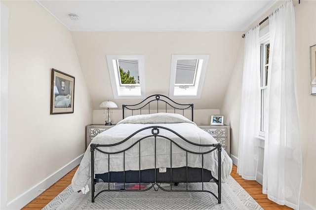 286 Kingstown Rd, Narragansett, RI 02882 - bedroom featuring light wood-type flooring, baseboards, and a skylight