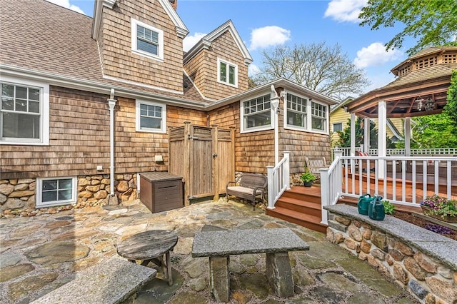286 Kingstown Rd, Narragansett, RI 02882 - back of property with a gazebo, a patio area, and a shingled roof